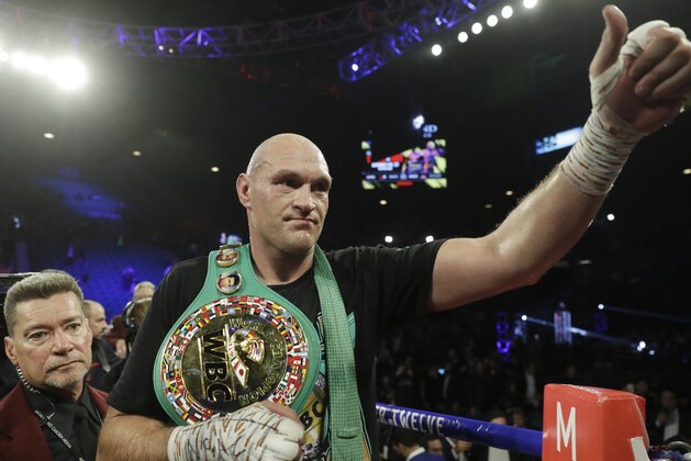 Tyson Fury, of England, celebrates after defeating Deontay Wilder during a WBC heavyweight championship boxing match Saturday, Feb. 22, 2020, in Las Vegas. (AP Photo/Isaac Brekken) Tyson Fury, of England, celebrates after defeating Deontay Wilder during a WBC heavyweight championship boxing match Saturday, Feb. 22, 2020, in Las Vegas. (AP Photo/Isaac Brekken)