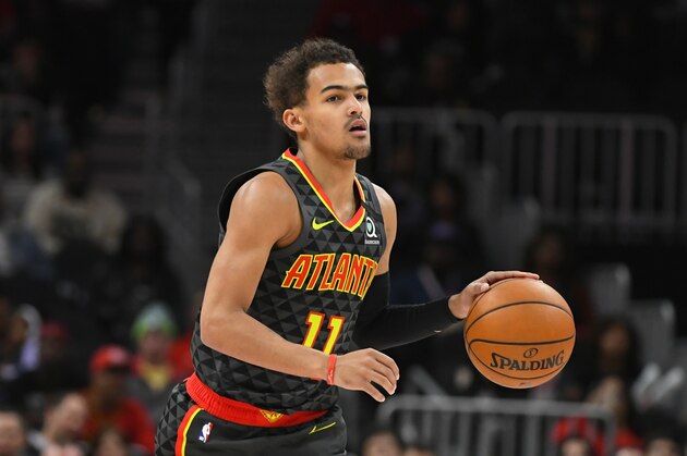 Atlanta Hawks guard Trae Young (11) dribbles upcourt during an NBA basketball game against the Charlotte Hornets, Monday, March 9, 2020, in Atlanta. (AP Photo/John Amis) Atlanta Hawks guard Trae Young (11) dribbles upcourt during an NBA basketball game against the Charlotte Hornets, Monday, March 9, 2020, in Atlanta. (AP Photo/John Amis)