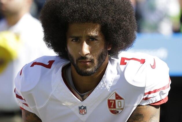 San Francisco 49ers quarterback Colin Kaepernick kneels during the singing of the national anthem before an NFL football game against the Seattle Seahawks, Sunday, Sept. 25, 2016, in Seattle. (AP Photo/Ted S. Warren)