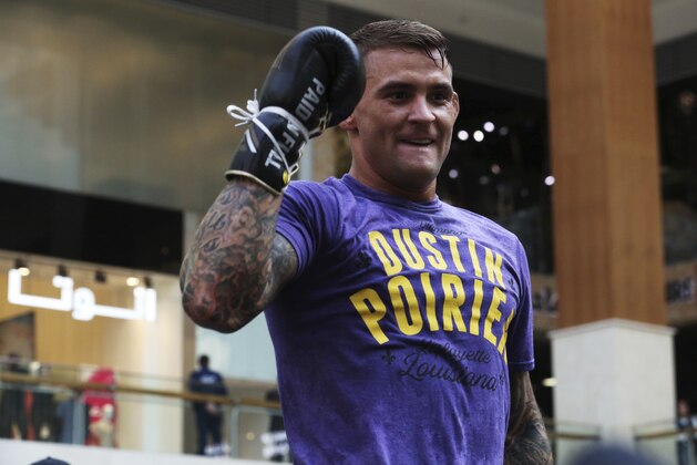 UFC fighter Dustin Poirier of Lafayette, Louisiana, gestures during an open training session at Yas Mall in Abu Dhabi, United Arab Emirates, Wednesday, Sept. 4, 2019. Fighters Dustin Poirier and Khabib Nurmagomedov will face each other in UFC 242, which will be held Saturday, Sept. 7, 2019, in Abu Dhabi. (AP Photo/Jon Gambrell)