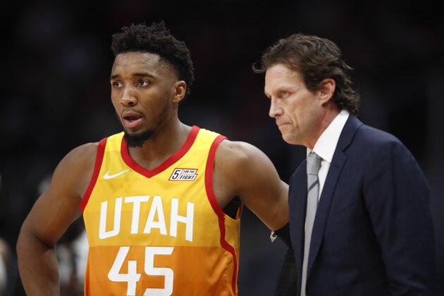 ATLANTA, GA - DECEMBER 19: Donovan Mitchell #45 of the Utah Jazz speaks with Quin Snyder during the second half of an NBA game against the Atlanta Hawks at State Farm Arena on December 19, 2019 in Atlanta, Georgia. NOTE TO USER: User expressly acknowledges and agrees that, by downloading and/or using this photograph, user is consenting to the terms and conditions of the Getty Images License Agreement. (Photo by Todd Kirkland/Getty Images)
