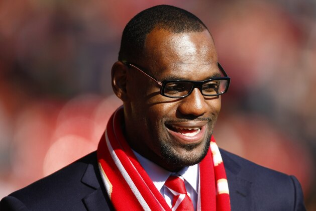U.S. and Miami Heat basketball player LeBron James looks on before the English Premier League soccer match between Liverpool and Manchester United at Anfield, Liverpool, England, Saturday Oct. 15, 2011. (AP Photo/Tim Hales)