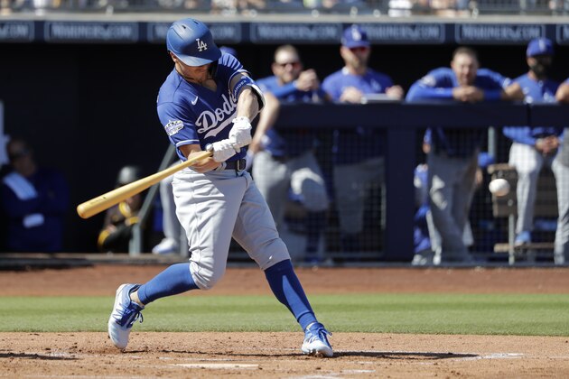 Los Angeles Dodgers' Kike Hernandez singles against the San Diego Padres in the second inning during a spring training baseball game Monday, March 9, 2020, in Peoria, Ariz. (AP Photo/Elaine Thompson)