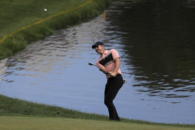 Rory McIlroy, of Northern Ireland, chips near the 16th green during the first round of the Travelers Championship golf tournament at TPC River Highlands, Thursday, June 25, 2020, in Cromwell, Conn. (AP Photo/Frank Franklin II) Rory McIlroy, of Northern Ireland, chips near the 16th green during the first round of the Travelers Championship golf tournament at TPC River Highlands, Thursday, June 25, 2020, in Cromwell, Conn. (AP Photo/Frank Franklin II)