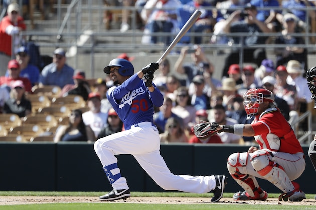 Los Angeles Dodgers' Mookie Betts bats during the first inning of a spring training baseball game against the Los Angeles Angels, Wednesday, Feb. 26, 2020, in Glendale, Ariz. (AP Photo/Gregory Bull)