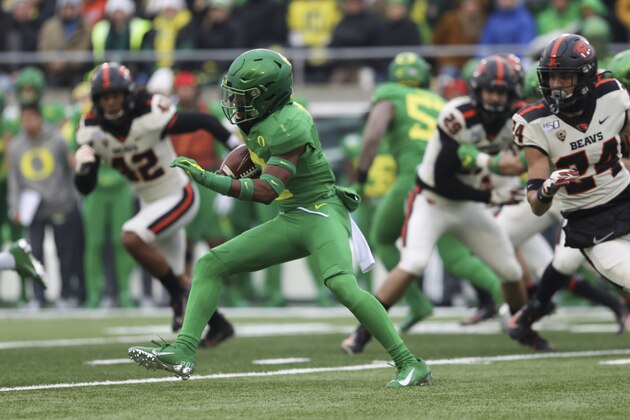 Oregon cornerback Mykael Wright (2) runs the ball to score a touchdown off a 98-yard kickoff return during the first half of an NCAA college football game against Oregon State in Eugene, Ore., Saturday, Nov. 30, 2019. (AP Photo/Amanda Loman)