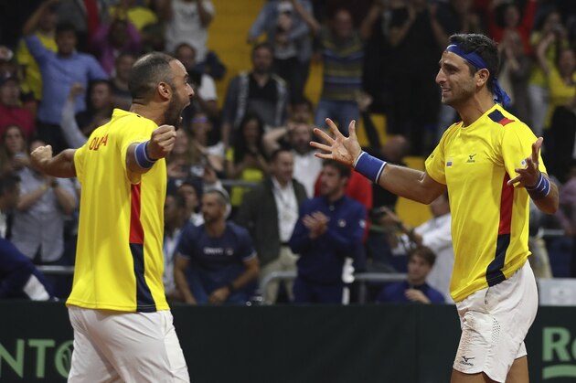 Colombia's Juan Sebastian Cabal, left and Robert Farah, celebrate after defeating Argentina's Horacio Zeballos and Maximo Gonzalez, at the end of their Davis Cup Rakuten Qualifiers tennis doubles match, in Bogota, Colombia, Saturday, March 7, 2020. (AP Photo/Fernando Vergara) Colombia's Juan Sebastian Cabal, left and Robert Farah, celebrate after defeating Argentina's Horacio Zeballos and Maximo Gonzalez, at the end of their Davis Cup Rakuten Qualifiers tennis doubles match, in Bogota, Colombia, Saturday, March 7, 2020. (AP Photo/Fernando Vergara)