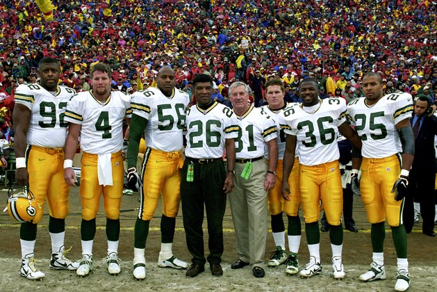 The Green Bay Packers Captains for the NFC Championship Game, a 23-10 victory over the San Francisco 49ers on January 11, 1998, at 3Com Park in San Francisco, California. The Captains are: Hall of Fame defensive end Reggie White (92), quarterback Brett Favre (4), linebacker Lamont Hollinquest (56), running back Travis Jervey (32), safety LeRoy Butler (36), and running back Dorsey Levens (25). Also included are two honorary captains, members of the Packer's Glory Days squads of the 1960s: Hall of Fame cornerback Herb Adderley (26) and Hall of Fame fullback Jim Taylor (31). (Photo by James V. Biever/Getty Images) The Green Bay Packers Captains for the NFC Championship Game, a 23-10 victory over the San Francisco 49ers on January 11, 1998, at 3Com Park in San Francisco, California. The Captains are: Hall of Fame defensive end Reggie White (92), quarterback Brett Favre (4), linebacker Lamont Hollinquest (56), running back Travis Jervey (32), safety LeRoy Butler (36), and running back Dorsey Levens (25). Also included are two honorary captains, members of the Packer's Glory Days squads of the 1960s: Hall of Fame cornerback Herb Adderley (26) and Hall of Fame fullback Jim Taylor (31). (Photo by James V. Biever/Getty Images)
