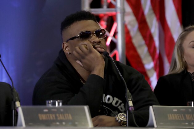 U.S. heavyweight boxer Jarrell Miller reacts as British heavyweight boxer Anthony Joshua speaks during their press conference at the Hilton London Syon Park hotel in London, Monday, Feb. 25, 2019. On June 1, Joshua will box Miller for Joshua's WBA Super-IBF-WBO-IBO heavyweight titles at Madison Square Garden in New York. (AP Photo/Matt Dunham)