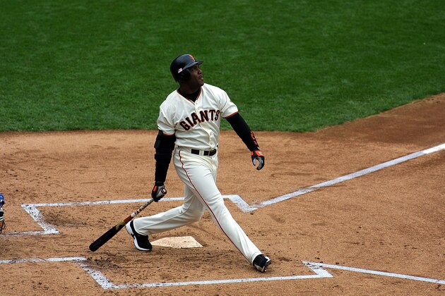 San Francisco Giants slugger Barry Bonds watches his ball fly over the right field wall after hitting his 73rd record breaking homerun of the season off Los Angeles Dodgers pitcher Dennis Springer during the first inning 07 October 2001. Bonds surpassed Mark McGwire's 70 season homerun mark. AFP PHOTO/Monica M. DAVEY (Photo by MONICA DAVEY / AFP)        (Photo credit should read MONICA DAVEY/AFP via Getty Images)