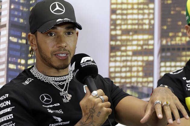 Mercedes driver Lewis Hamilton of Britain speaks during a press conference at the Australian Formula One Grand Prix in Melbourne, Thursday, March 12, 2020. Six-time world champion Lewis Hamilton has questioned the wisdom of staging the season-opening Formula One Grand Prix while other sports are canceling events because of the spreading coronavirus. (AP Photo/Rick Rycroft)
