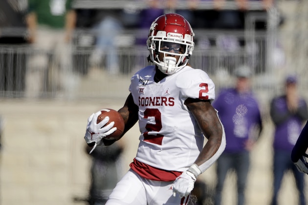 Oklahoma wide receiver CeeDee Lamb runs the ball during the first half of an NCAA college football game against Kansas State Saturday, Oct. 26, 2019, in Manhattan, Kan. (AP Photo/Charlie Riedel)