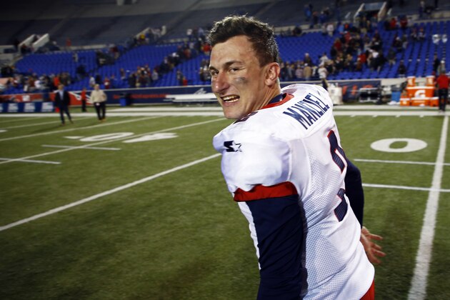 Memphis Express quarterback Johnny Manziel celebrates as he leaves the field after a Birmingham Iron at Memphis Express AAF football game, Sunday, March 24, 2019, at Liberty Bowl Memorial Stadium in Memphis, Tenn. against the Memphis won in overtime 31-25. (AP Photo/Wade Payne)