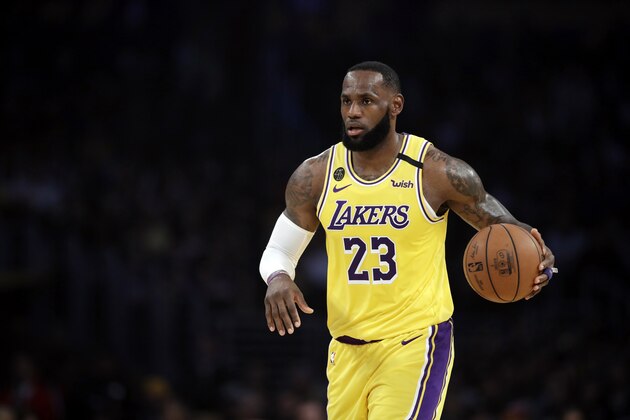 Los Angeles Lakers' LeBron James (23) dribbles during the first half of an NBA basketball game against the Brooklyn Nets Tuesday, March 10, 2020, in Los Angeles. (AP Photo/Marcio Jose Sanchez) Los Angeles Lakers' LeBron James (23) dribbles during the first half of an NBA basketball game against the Brooklyn Nets Tuesday, March 10, 2020, in Los Angeles. (AP Photo/Marcio Jose Sanchez)