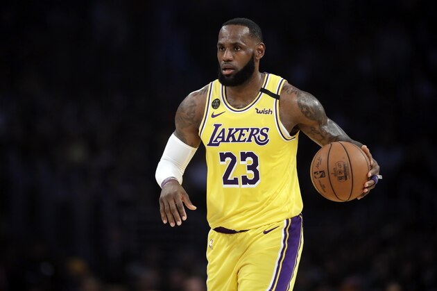 Los Angeles Lakers' LeBron James (23) dribbles during the first half of an NBA basketball game against the Brooklyn Nets Tuesday, March 10, 2020, in Los Angeles. (AP Photo/Marcio Jose Sanchez) Los Angeles Lakers' LeBron James (23) dribbles during the first half of an NBA basketball game against the Brooklyn Nets Tuesday, March 10, 2020, in Los Angeles. (AP Photo/Marcio Jose Sanchez)
