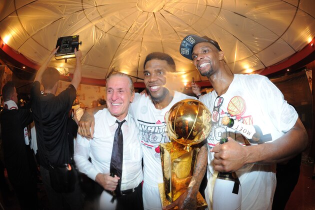 MIAMI, FL - JUNE 20: Pat Riley, Udonis Haslem #40 and Chris Bosh #1 of the Miami Heat pose for a photo while celebrating after defeating the San Antonio Spurs in Game Seven of the 2013 NBA Finals and being named the 2013 NBA Champions on June 20, 2013 at the American Airlines Arena in Miami, Florida. NOTE TO USER: User expressly acknowledges and agrees that, by downloading and or using this photograph, User is consenting to the terms and conditions of the Getty Images License Agreement. Mandatory Copyright Notice: Copyright 2013 NBAE (Photo by Andrew D. Bernstein/NBAE via Getty Images)