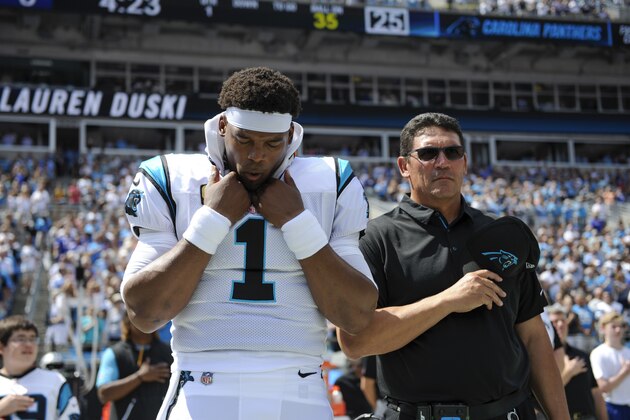 Carolina Panthers quarterback Cam Newton (1) and Carolina Panthers head coach Ron Rivera stand together before the start of an NFL football game against the Buffalo Bills in Charlotte, N.C., Sunday, Sept. 17, 2017. (AP Photo/Mike McCarn)