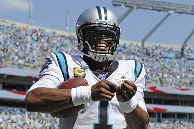 Carolina Panthers quarterback Cam Newton (1) reacts following running back Christian McCaffrey's touchdown against the Los Angeles Rams during the second half of an NFL football game in Charlotte, N.C., Sunday, Sept. 8, 2019. (AP Photo/Mike McCarn)