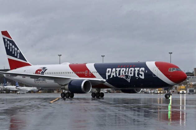 The New England Patriots football team's jet taxis on the tarmac, Thursday, April 2, 2020, at Logan Airport, in Boston, after returning from China with more than one million N95 respirator masks. The Kraft family deployed the Patriots team plane to China to fetch the masks for use by front-line health care workers to prevent the spread of the coronavirus (Jim Davis/The Boston Globe via AP, Pool)