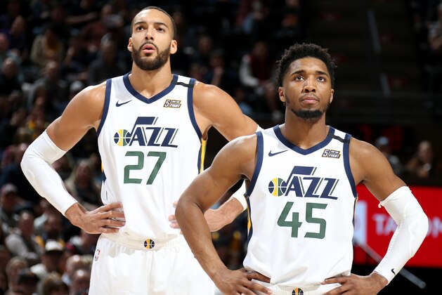 SALT LAKE CITY, UT - FEBRUARY 28: Rudy Gobert #27 of the Utah Jazz and Donovan Mitchell #45 of the Utah Jazz look on during the game against the Washington Wizards on February 28, 2020 at vivint.SmartHome Arena in Salt Lake City, Utah. NOTE TO USER: User expressly acknowledges and agrees that, by downloading and or using this Photograph, User is consenting to the terms and conditions of the Getty Images License Agreement. Mandatory Copyright Notice: Copyright 2020 NBAE (Photo by Melissa Majchrzak/NBAE via Getty Images)