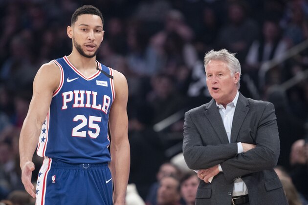 Philadelphia 76ers guard Ben Simmons (25) talks to head coach Brett Brown in the first half of an NBA basketball game against the New York Knicks, Saturday, Jan. 18, 2020, at Madison Square Garden in New York. (AP Photo/Mary Altaffer)