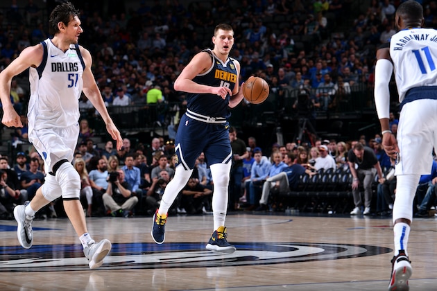 DALLAS, TX - MARCH 11: Nikola Jokic #15 of the Denver Nuggets handles the ball against the Dallas Mavericks on March 11, 2020 at the American Airlines Center in Dallas, Texas. NOTE TO USER: User expressly acknowledges and agrees that, by downloading and or using this photograph, User is consenting to the terms and conditions of the Getty Images License Agreement. Mandatory Copyright Notice: Copyright 2020 NBAE (Photo by Glenn James/NBAE via Getty Images)