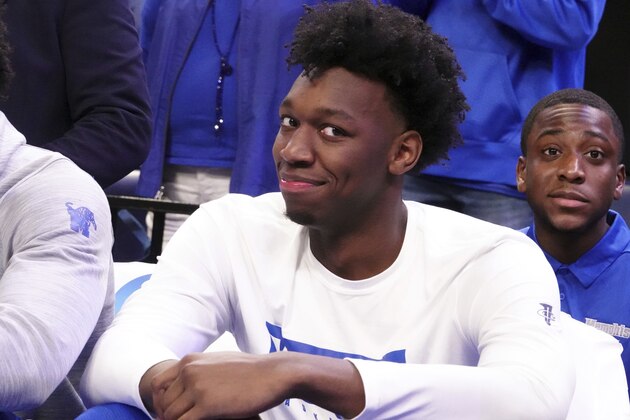 Memphis' James Wiseman smiles from his spot on the bench as he sat out of an NCAA college basketball game against Alcorn State Saturday, Nov. 16, 2019, in Memphis, Tenn. (AP Photo/Karen Pulfer Focht)