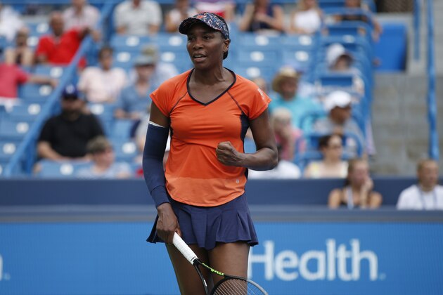 Venus Williams pumps her fist after winning a game against Lauren Davis during first round play at the Western & Southern Open tennis tournament, Monday, Aug. 12, 2019, in Mason, Ohio. (AP Photo/Gary Landers)