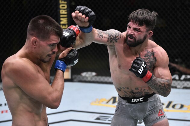 LAS VEGAS, NEVADA - JUNE 27: In this handout image provided by UFC, (R-L) Mike Perry punches Mickey Gall in their welterweight fight during the UFC Fight Night event at UFC APEX on June 27, 2020 in Las Vegas, Nevada. (Photo by Chris Unger/Zuffa LLC via Getty Images)