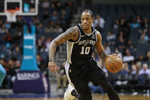 San Antonio Spurs forward DeMar DeRozan runs the offense against the Charlotte Hornets during the second half of an NBA basketball game in Charlotte, N.C., Tuesday, March 3, 2020. San Antonio won 104-103. (AP Photo/Nell Redmond)