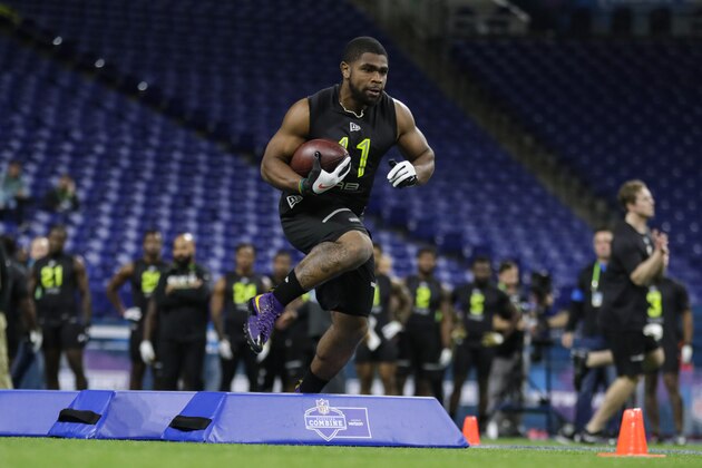 LSU running back Clyde Edwards-Helaire runs a drill at the NFL football scouting combine in Indianapolis, Friday, Feb. 28, 2020. (AP Photo/Michael Conroy)