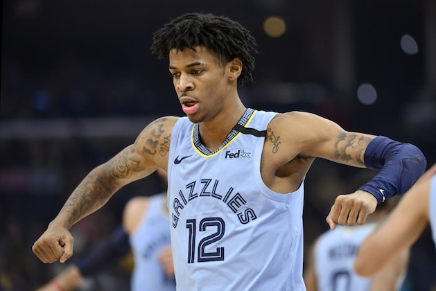 Memphis Grizzlies guard Ja Morant (12) reacts in the second half of an NBA basketball game against the Los Angeles Lakers Saturday, Feb. 29, 2020, in Memphis, Tenn. (AP Photo/Brandon Dill) Memphis Grizzlies guard Ja Morant (12) reacts in the second half of an NBA basketball game against the Los Angeles Lakers Saturday, Feb. 29, 2020, in Memphis, Tenn. (AP Photo/Brandon Dill)