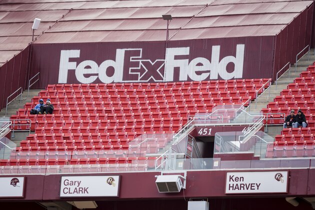 LANDOVER, MD - NOVEMBER 24: A general view of a couple of fans in their otherwise empty section before the game between the Washington Redskins and the Detroit Lions at FedExField on November 24, 2019 in Landover, Maryland. (Photo by Scott Taetsch/Getty Images)