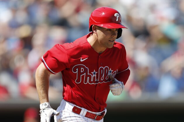 Philadelphia Phillies' Scott Kingery runs to first during a spring training baseball game, Wednesday, March 4, 2020, in Clearwater, Fla. (AP Photo/Carlos Osorio)