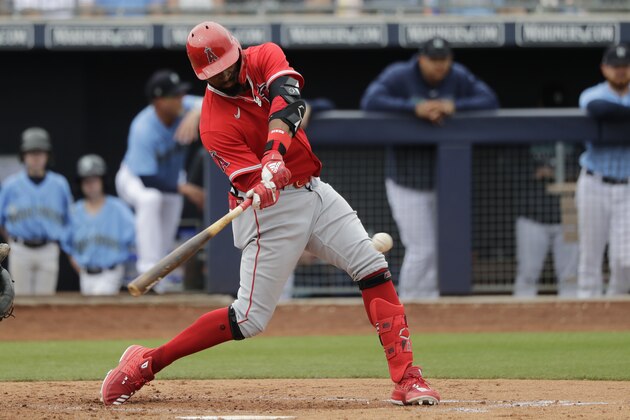 Los Angeles Angels' Jo Adell bats against the Seattle Mariners during a spring training baseball game Tuesday, March 10, 2020, in Peoria, Ariz. (AP Photo/Elaine Thompson)
