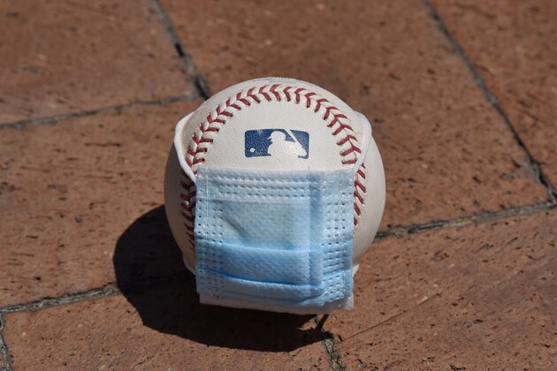 DETROIT, MI - JULY 01:  A detailed view of an official Major League Baseball with a surgical mask placed on it sitting outdie of Comerica Park on July 1, 2020 in Detroit, Michigan.  (Photo by Mark Cunningham/MLB Photos via Getty Images)