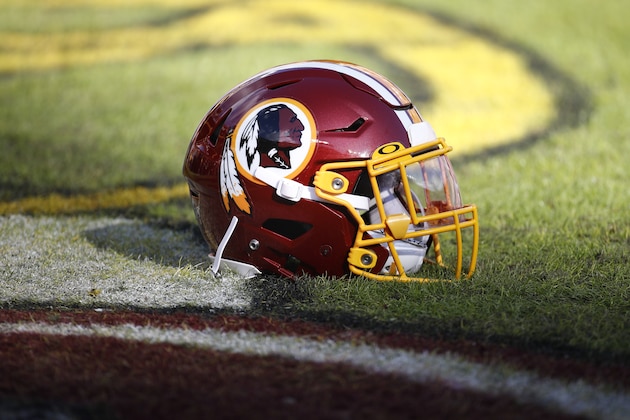 Washington Redskins helmets sits on the field before the start of an NFL football game between the Washington Redskins and the Philadelphia Eagles, Sunday, Dec. 15, 2019, in Landover, Md. (AP Photo/Patrick Semansky)