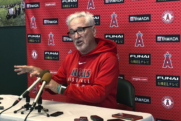 Los Angeles Angels manager Joe Maddon gestures while speaking to media members at Tempe Diablo Stadium in Tempe, Ariz., on Tuesday, Feb. 11, 2020. Maddon is thrilled to be back with the organization where he spent the first three decades of his baseball career. (AP Photo/Greg Beacham)