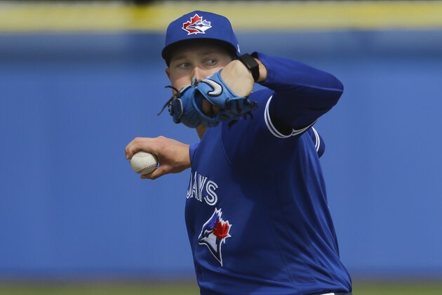Toronto Blue Jays' Nate Pearson delivers a pitch during live batting practice at a spring training baseball workout Friday, Feb. 21, 2020, in Dunedin, Fla. (AP Photo/Frank Franklin II)