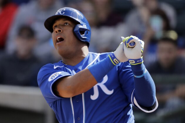 Kansas City Royals' Salvador Perez bats during the third inning of a spring training baseball game against the Cleveland Indians Sunday, Feb. 23, 2020, in Surprise, Ariz. (AP Photo/Charlie Riedel)