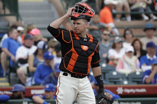 San Francisco Giants catches Buster Posey against the Chicago Cubs during the first inning of a spring training baseball game Tuesday, March 10, 2020, in Scottsdale, Ariz. (AP Photo/Matt York)