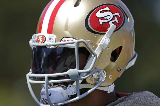 San Francisco 49ers' quarterback Colin Kaepernick wears a helmet with a tinted visor during NFL football training camp Wednesday, Aug. 10, 2016, at Kezar Stadium in San Francisco. (AP Photo/Ben Margot)