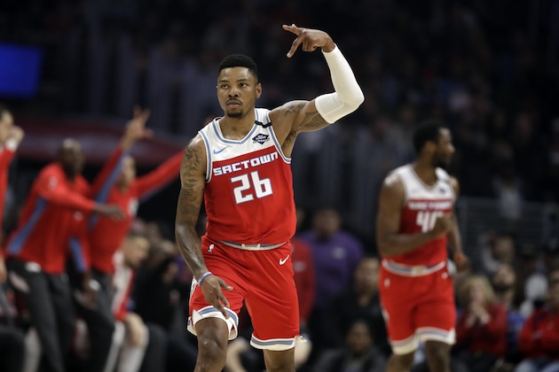 Sacramento Kings' Kent Bazemore (26) reacts after scoring against the Los Angeles Clippers during the first half of an NBA basketball game Saturday, Feb. 22, 2020, in Los Angeles. (AP Photo/Marcio Jose Sanchez)
