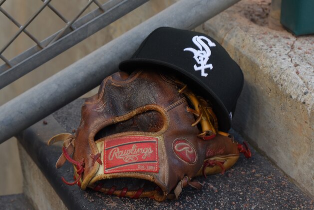 DETROIT, MI - AUGUST 05: A detailed view of a Chicago White Sox baseball hat and a Rawlings glove sitting in the dugout during the game against the Detroit Tigers at Comerica Park on August 5, 2019 in Detroit, Michigan. The White Sox defeated the Tigers 7-4. (Photo by Mark Cunningham/MLB Photos via Getty Images) DETROIT, MI - AUGUST 05: A detailed view of a Chicago White Sox baseball hat and a Rawlings glove sitting in the dugout during the game against the Detroit Tigers at Comerica Park on August 5, 2019 in Detroit, Michigan. The White Sox defeated the Tigers 7-4. (Photo by Mark Cunningham/MLB Photos via Getty Images)