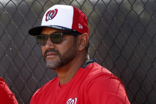 Washington Nationals manager Dave Martinez watches his team during spring training baseball practice Friday, Feb. 14, 2020, in West Palm Beach, Fla. (AP Photo/Jeff Roberson)