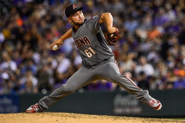 DENVER, CO - SEPTEMBER 10: Silvino Bracho #61 of the Arizona Diamondbacks pitches against the Colorado Rockies  at Coors Field on September 10, 2018 in Denver, Colorado.  (Photo by Dustin Bradford/Getty Images)