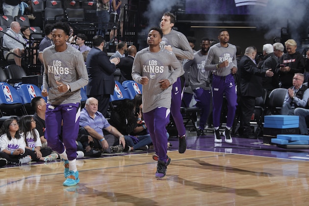 SACRAMENTO, CA - MARCH 12: De'Aaron Fox #5, Yogi Ferrell #3, Nemanja Bjelica #88 and Kent Bazemore #26 of the Sacramento Kings run onto the court prior to the game against the New Orleans Pelicans on March 12, 2020 at Golden 1 Center in Sacramento, California. NOTE TO USER: User expressly acknowledges and agrees that, by downloading and or using this photograph, User is consenting to the terms and conditions of the Getty Images Agreement. Mandatory Copyright Notice: Copyright 2020 NBAE (Photo by Rocky Widner/NBAE via Getty Images)