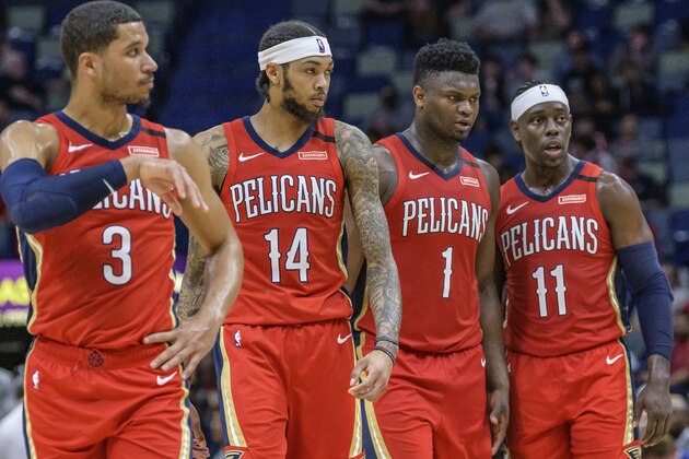 New Orleans Pelicans guard Jrue Holiday (11), forward Zion Williamson (1), forward Brandon Ingram (14), and guard Josh Hart (3) talk strategy in the second half of an NBA basketball game against the Minnesota Timberwolves in New Orleans, Tuesday, March 3, 2020. (AP Photo/Matthew Hinton)