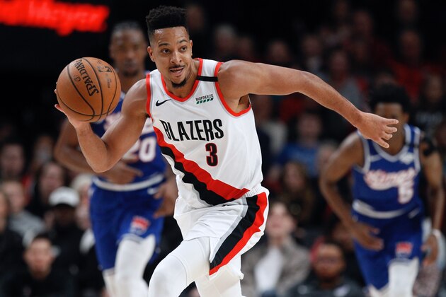 Portland Trail Blazers guard CJ McCollum pushes the ball upcourt against the Sacramento Kings during the first half of an NBA basketball game in Portland, Ore., Saturday, March 7, 2020. (AP Photo/Steve Dipaola)