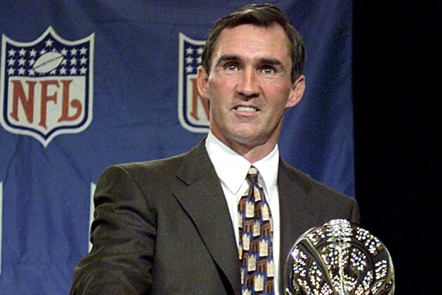 Defending Super Bowl Champion's Denver Broncos' head coach Mike Shanahan poses behind the Vince Lombardi trophy after he addressed the media in a pregame press conference 29 January in Miami, FL. Shanahan, the winningest coach in postseason history, talked about his team's preparation against the Atlanta Falcons in Super Bowl XXXIII 31 January.(ELECTRONIC IMAGE) AFP PHOTO/Stephen JAFFE (Photo by STEPHEN JAFFE / AFP) (Photo by STEPHEN JAFFE/AFP via Getty Images) Defending Super Bowl Champion's Denver Broncos' head coach Mike Shanahan poses behind the Vince Lombardi trophy after he addressed the media in a pregame press conference 29 January in Miami, FL. Shanahan, the winningest coach in postseason history, talked about his team's preparation against the Atlanta Falcons in Super Bowl XXXIII 31 January.(ELECTRONIC IMAGE) AFP PHOTO/Stephen JAFFE (Photo by STEPHEN JAFFE / AFP) (Photo by STEPHEN JAFFE/AFP via Getty Images)